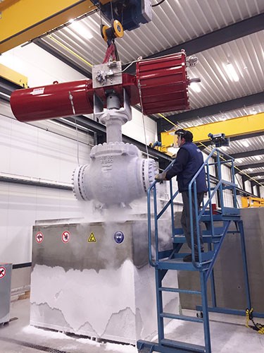 Eccentric ball valve being lifted out of the test bench for fugitive emission testing. Photo courtesy AEV Valves Belgium